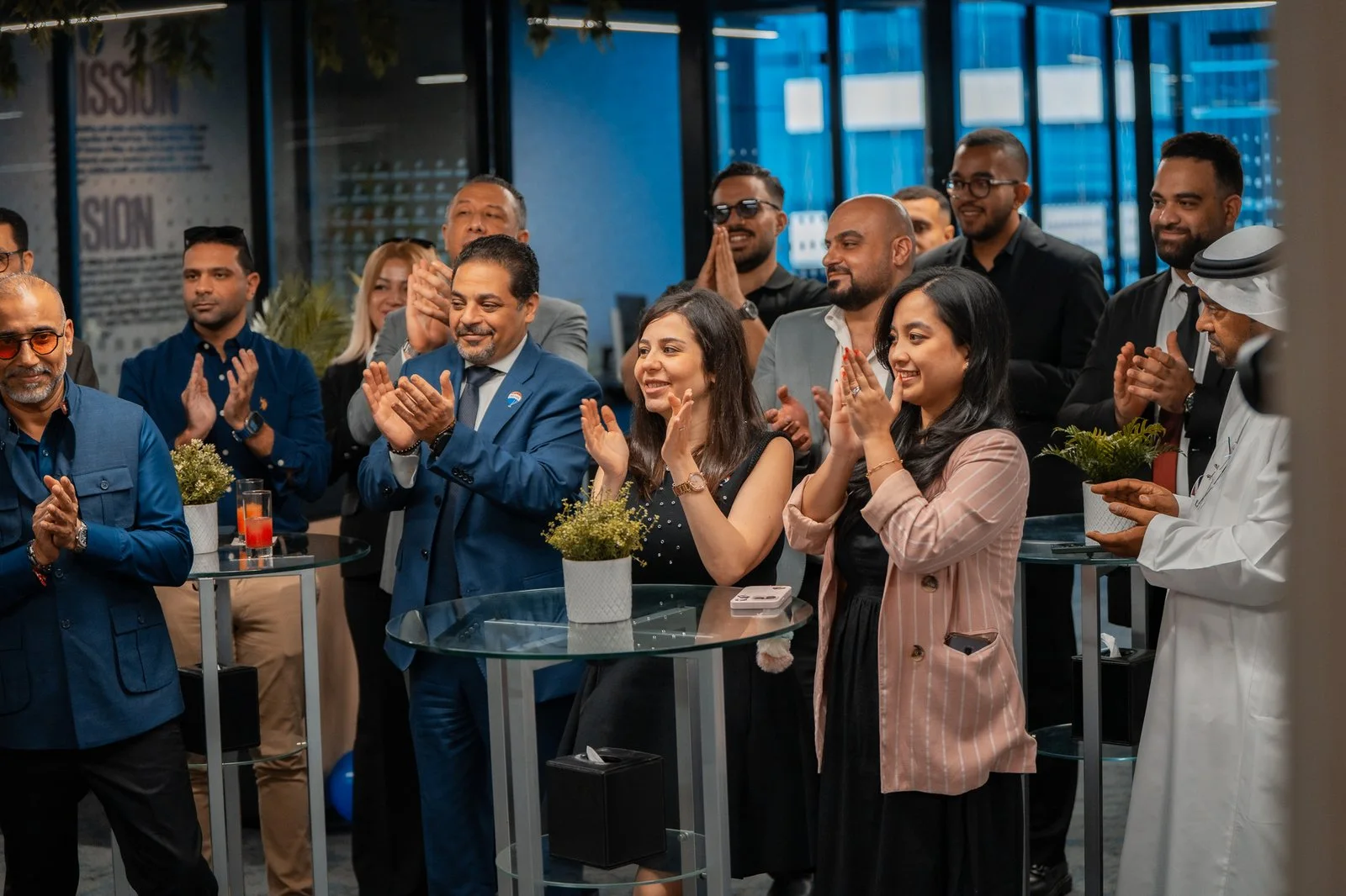 People gathered for an event inside the REMAX Ultima office