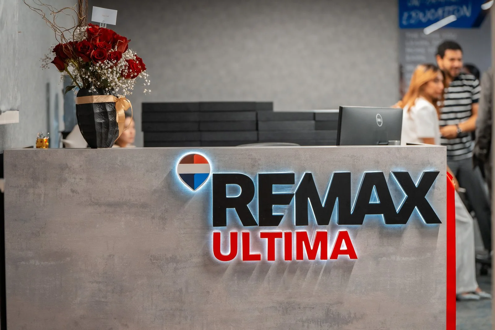 The illuminated REMAX Ultima sign at our office reception
